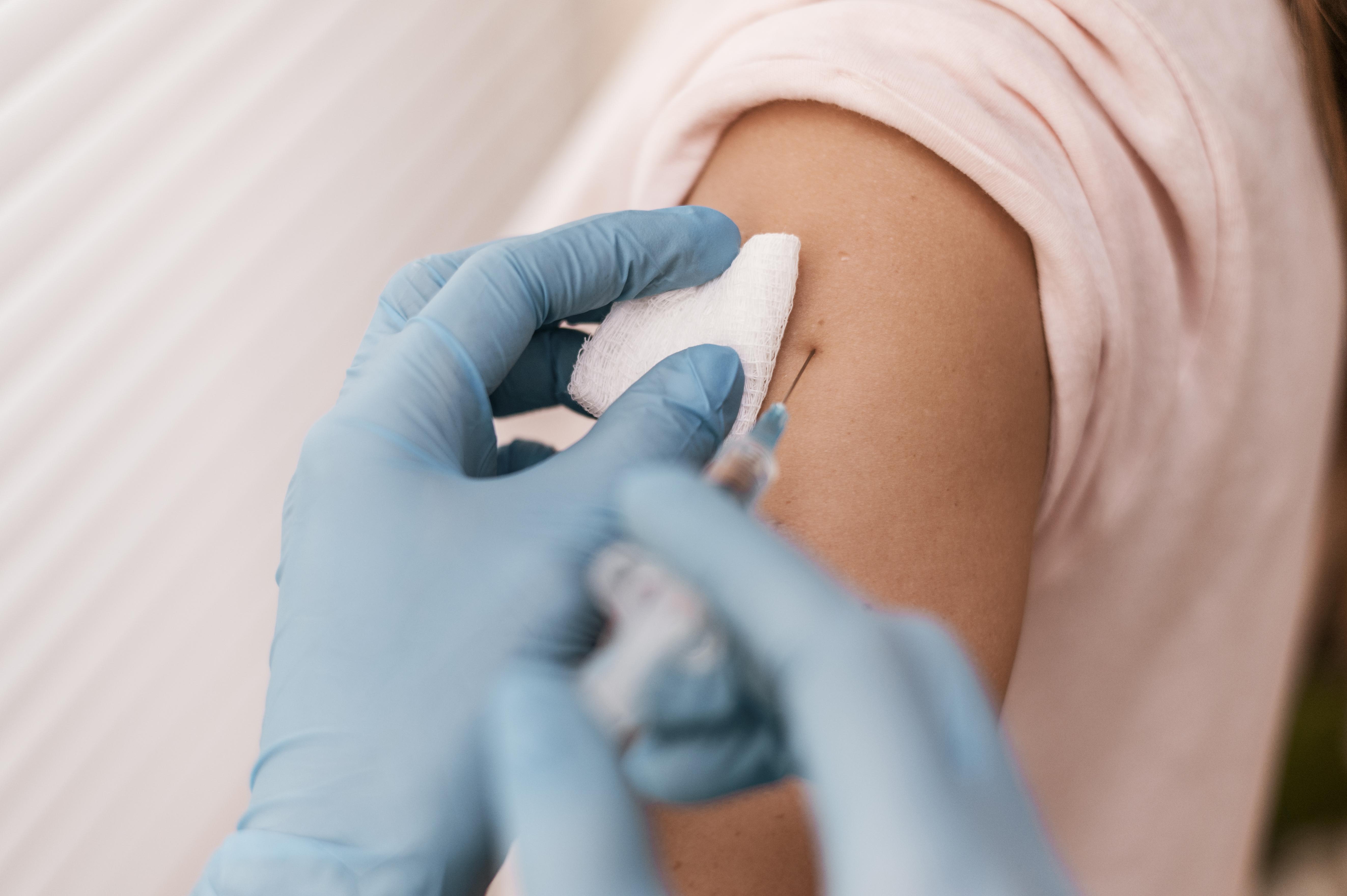 High angle patient getting their vaccine